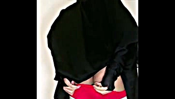 She's wearing a hijab, but her big ass is tempting